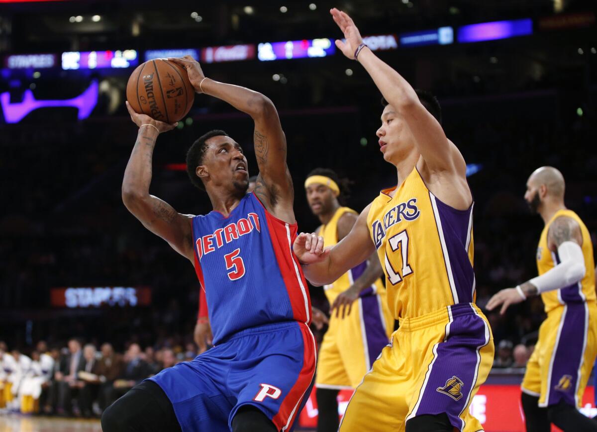 Detroit guard Kentavious Caldwell-Pope looks to shoot over Jeremy Lin during the first half of the Lakers' game Tuesday against the Pistons at Staples Center.