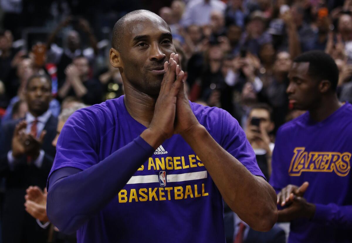 Lakers star Kobe Bryant thanks the Air Canada Centre crowd following a video tribute to him during a game against the Raptors.