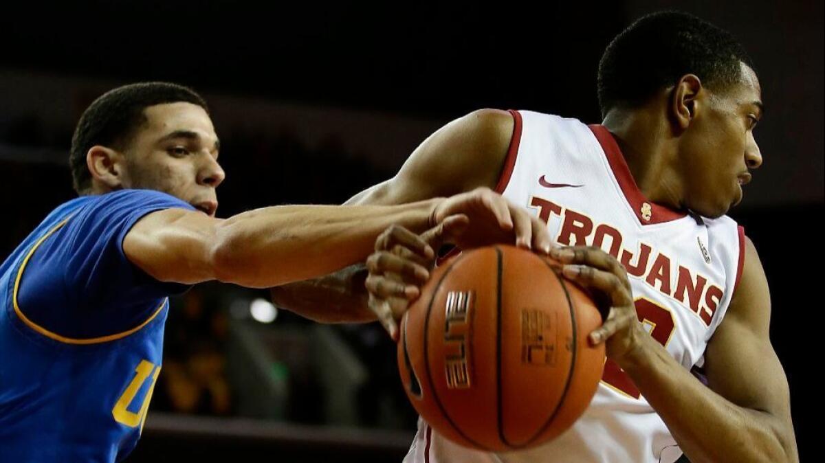 UCLA guard Lonzo Ball strips the ball from USC guard De'Anthony Melton during a game at Galen Center in January.