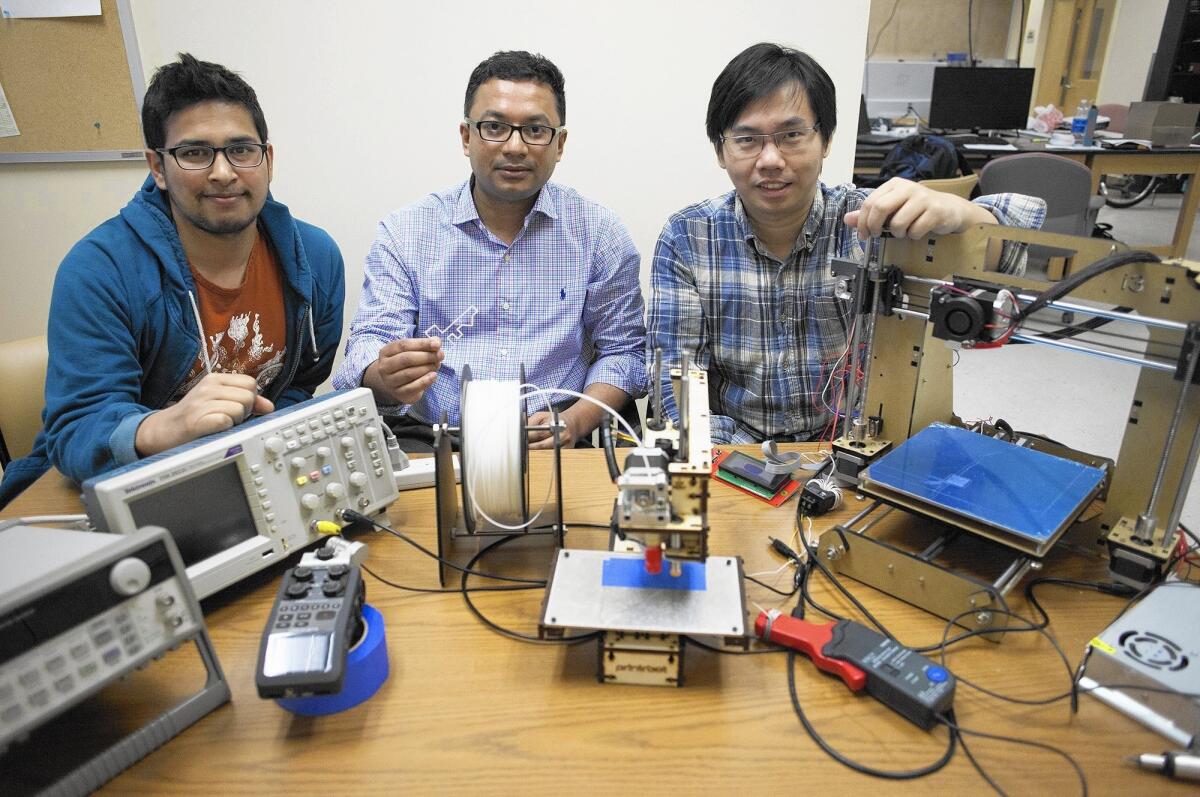 Mohammad Al Faruque, center, director of UC Irvine's Advanced Integrated Cyber-Physical Systems Lab, and graduate students Sujit Rokka-Chhetri, left, and Jiang Wan have been working since last summer on research of how 3-D printing machines' emanations can reveal sensitive product information.