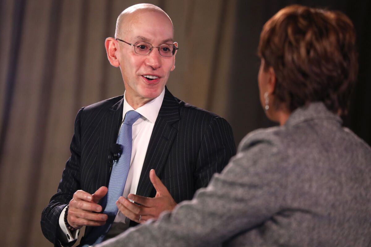 NBA Commissioner Adam Silver, left, speaks to host Robin Roberts during the Time 100 Health Summit in New York on Thursday.