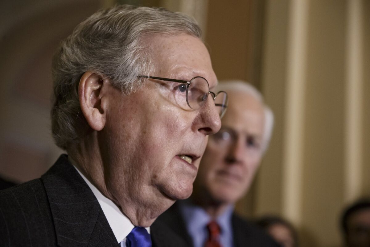 Senate Majority Leader Mitch McConnell (R-Ky.), joined by Majority Whip John Cornyn of Texas, says the Senate is stuck over a bill funding the Homeland Security Department and overturning President Obama's policies on immigration.