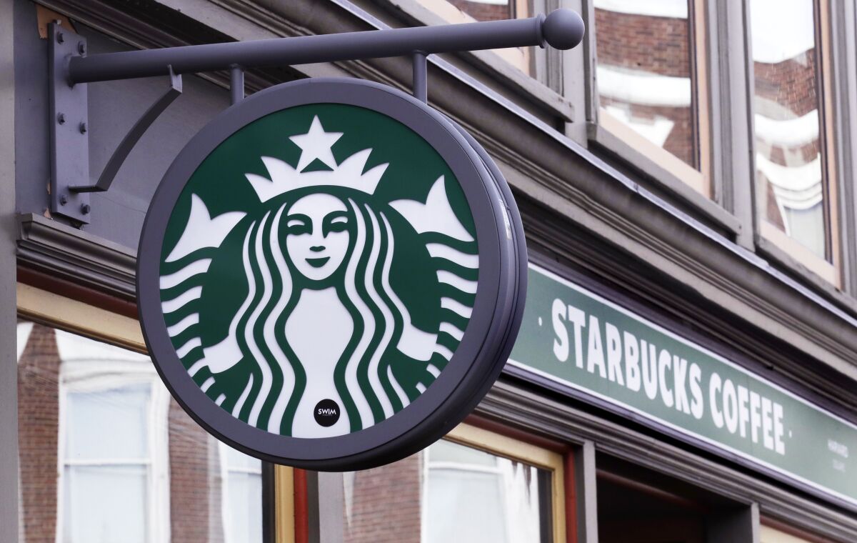 FILE - A sign for a Starbucks Coffee shop is pictured in Harvard Square in Cambridge, Mass., Dec. 13, 2018. The Seattle-based coffee giant said its revenue rose 9% to $8.2 billion during the April-June 2022 period, a quarterly record. That surpassed Wall Street’s forecast of $8.1 billion, according to analysts polled by FactSet. (AP Photo/Charles Krupa, File)