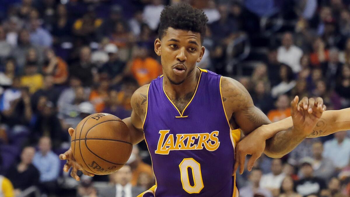 Lakers small forward Nick Young dribbles the ball during a 115-100 road loss to the Phoenix Suns earlier this season.