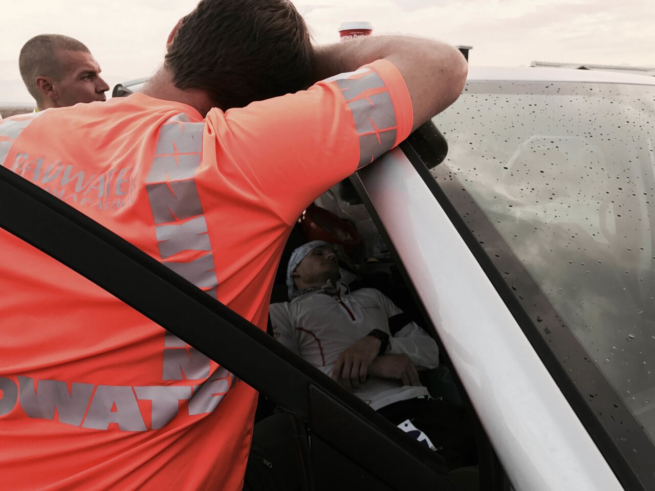 Personal trainer Jared Fetterolf was advised to lie down in his support van to quell stomach pain, which he did as a paramedic looked on. He only lasted a couple minutes before he couldn't stand not moving, and rejoined the race.