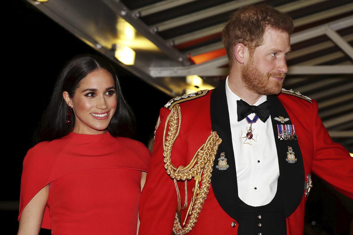 Britain's Prince Harry and Meghan, duchess of Sussex, arrive at the Royal Albert Hall in London on Saturday to attend the Mountbatten Festival of Music.