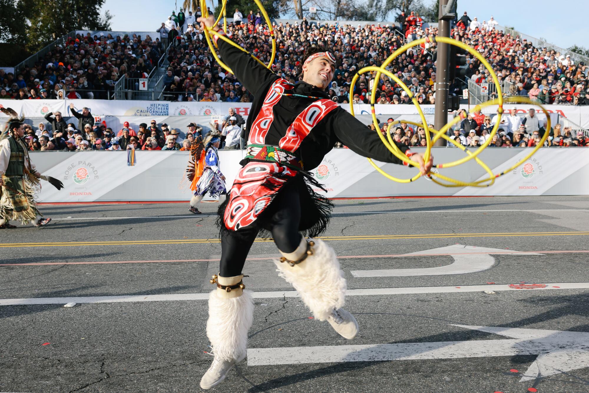A dancer with N8tive Hoop performs during the 2023 Rose Parade.