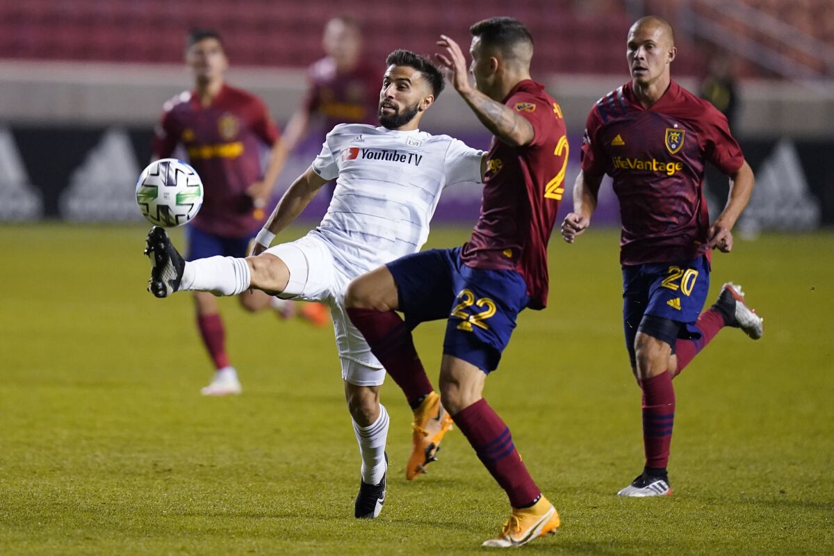 LAFC forward Diego Rossi controls the ball as Real Salt Lake's Aaron Herrera defends on Oct. 4 in Sandy, Utah. 