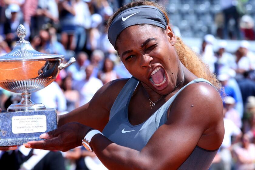 Serena Williams celebrates after receiving the winner's trophy at the Italian Open on Sunday in Rome.