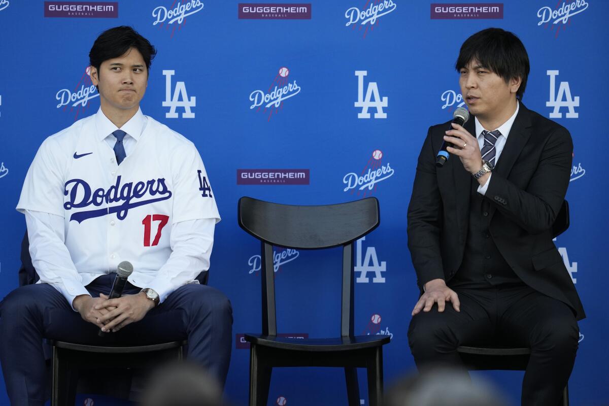 Dodgers star Shohei Ohtani and interpreter Ippei Mizuhara answer questions during a news conference at Dodger Stadium