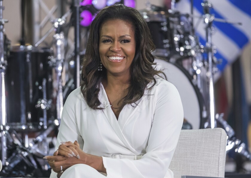 Michelle Obama, shown participating in the International Day of the Girl on NBC's "Today" show in New York in October, has seen record success for her memoir.