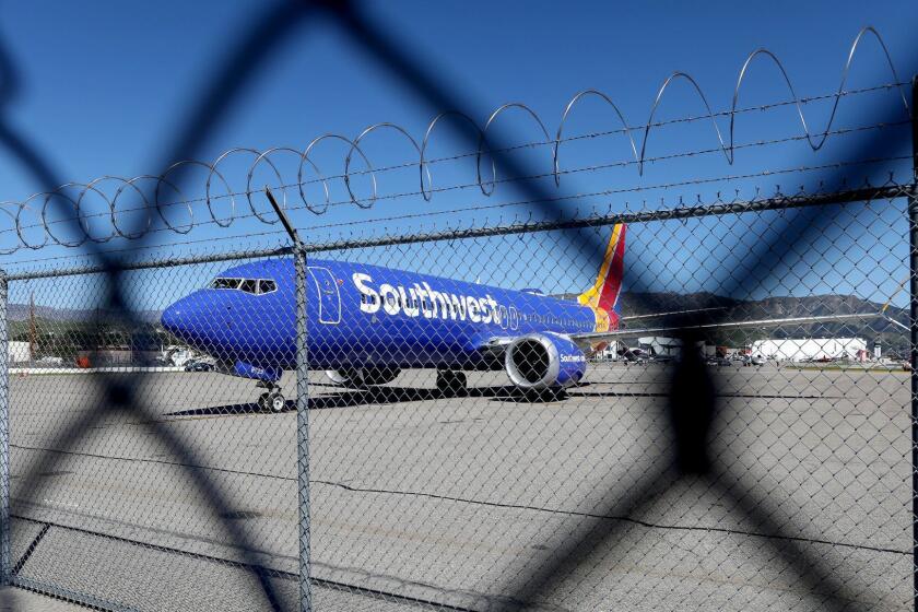 BURBANK, CALIF. -- WEDNESDAY, MARCH 13, 2019: A Southwest Airlines Boeing 737 Max 8 plane is grounded at Hollywood Burbank Airport in Burbank, Calif., on March 13, 2019. President Donald Trump's administration is grounding Boeing 737 Max planes. (Gary Coronado / Los Angeles Times)