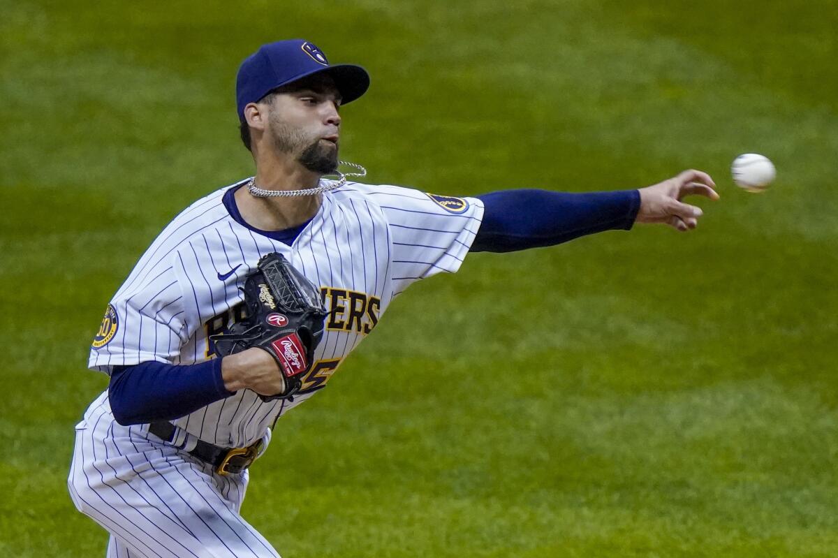 Reliever Alex Claudio throws during a game between the Milwaukee Brewers and Chicago Cubs in September.