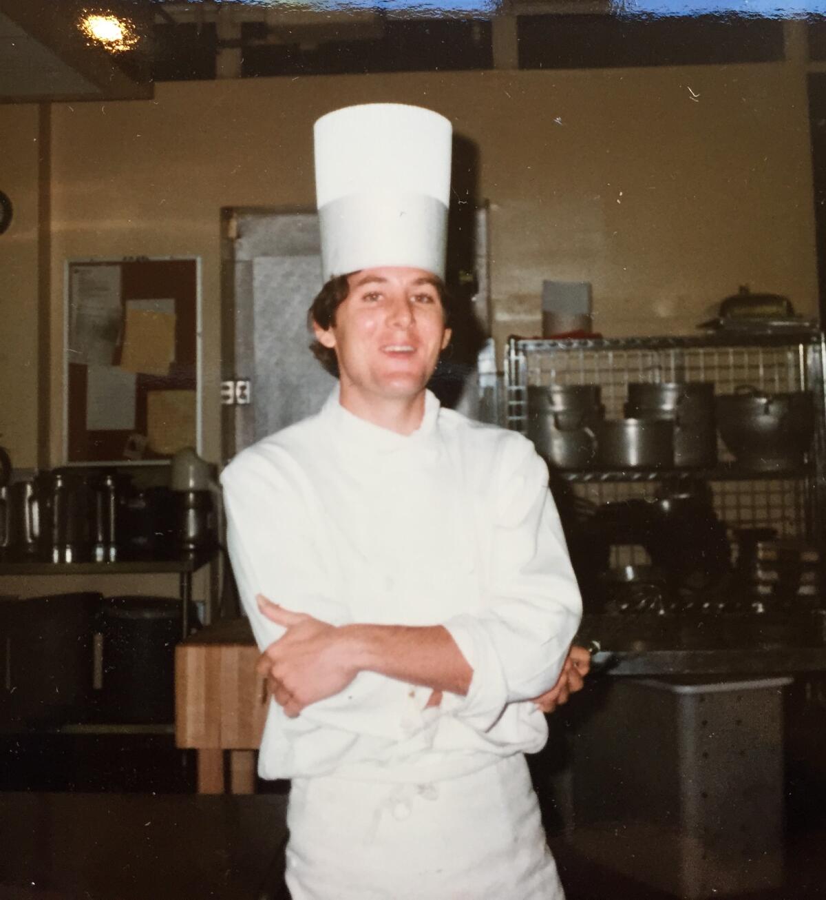 A chef standing in a kitchen in the documentary "Love, Charlie: The Rise and Fall of Chef Charlie Trotter."