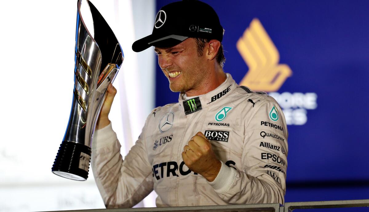 Formula One driver Nico Rosberg celebrates after winning the Singapore Grand Prix on Sunday.