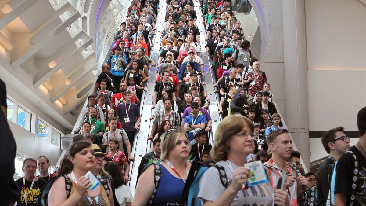 Comic-Con attendees pack the escalators at the San Diego Convention Center in this file photo. Even after the coronavirus is much less of a threat, millions of people will continue to fear crowds and change their behavior as consumers as a result.