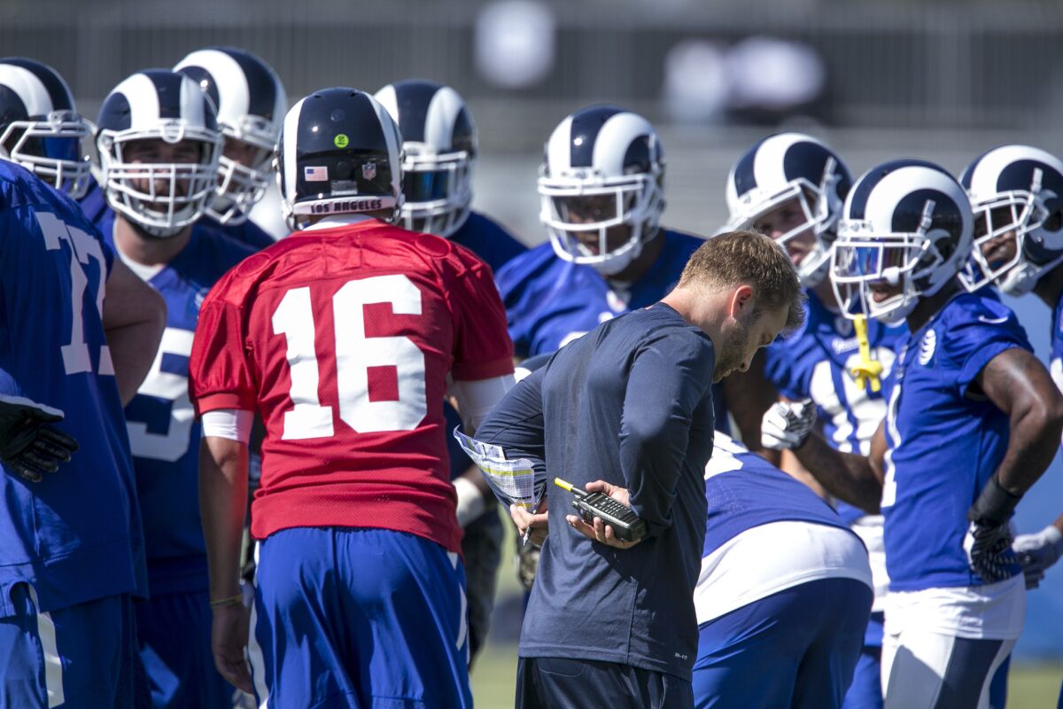 Rams coach Sean McVay listens in as quarterback Jared Goff calls a play during a scrimmage at training camp at UC Irvine.