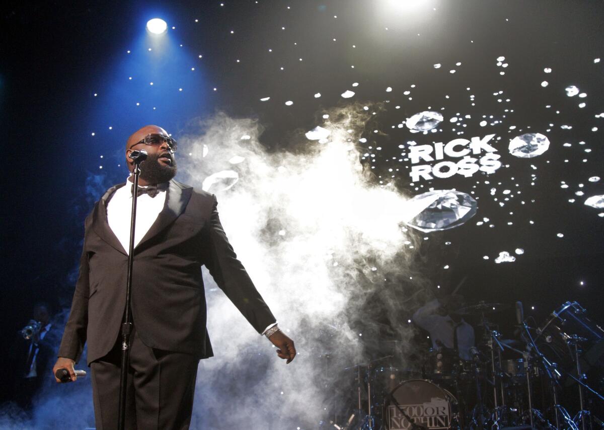 Rick Ross, seen here at his Aug. 14, 2013 concert, performed his song "Sanctified" with Kanye West and Big Sean on Thursday night on "The Arsenio Hall Show."