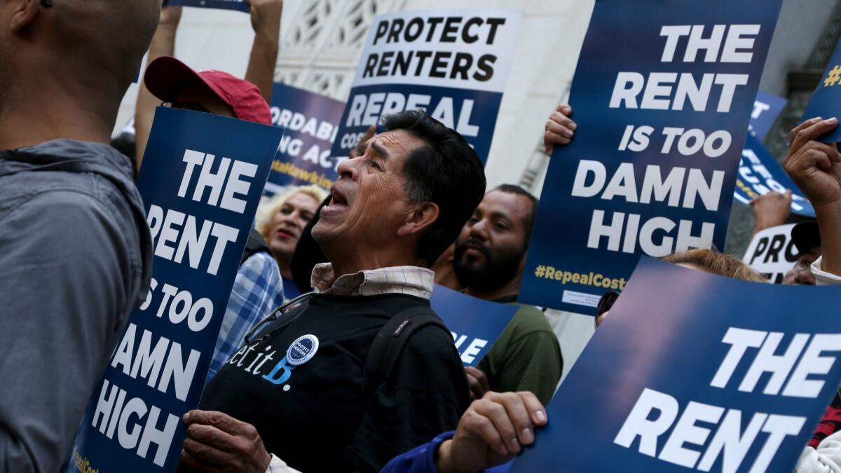 Advocates chant on the steps of City Hall before the announcement of a total of over 565,000 voter signatures to County Registrars in all 58 California counties in support of ballot initiative to repeal the Costa-Hawkins Rental Housing Act.