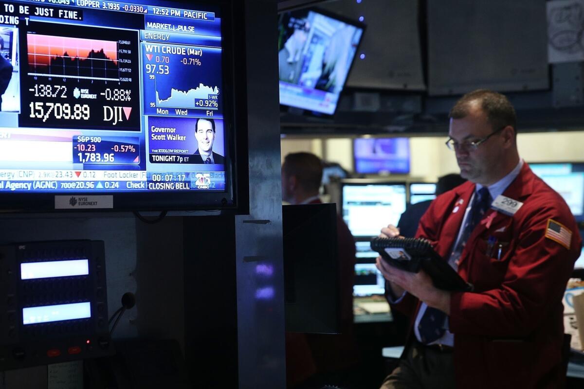 Traders work on the floor of the New York Stock Exchange on Friday.