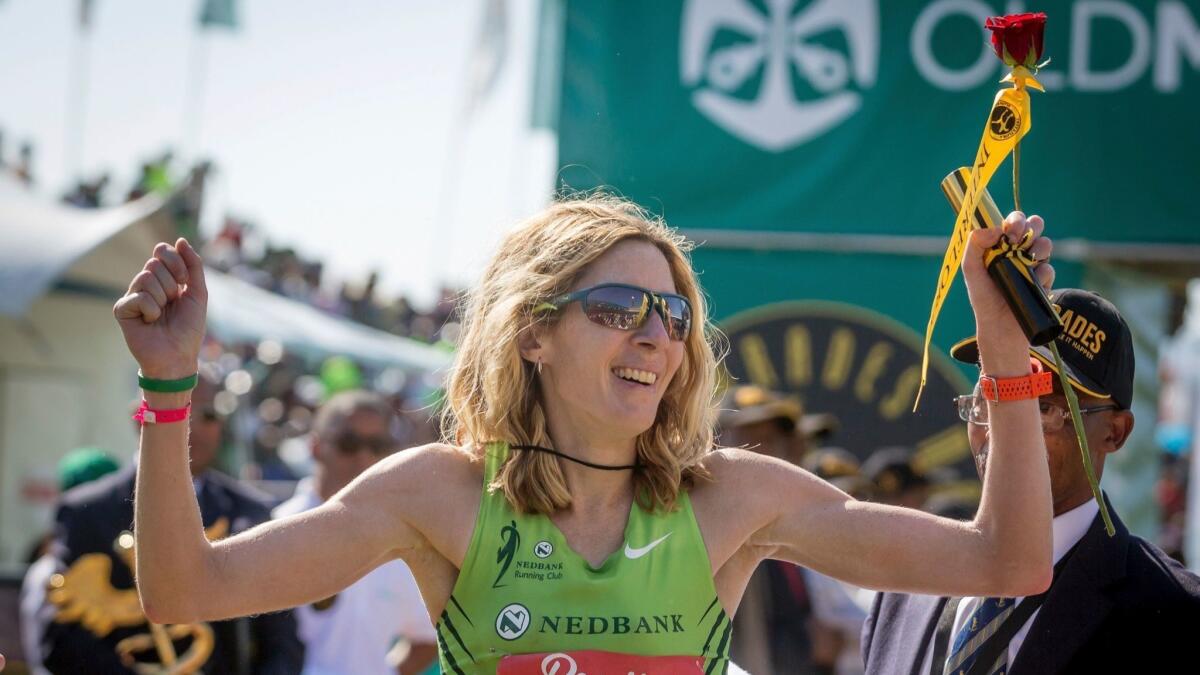 United States long-distance runner Camille Herron reacts after winning the 89km Comrades Marathon between Durban and Pietermaritzburg on June 4, 2017, in Pietermaritzburg. The annual ultra marathon this year attracted over 17,000 runners from around the world.