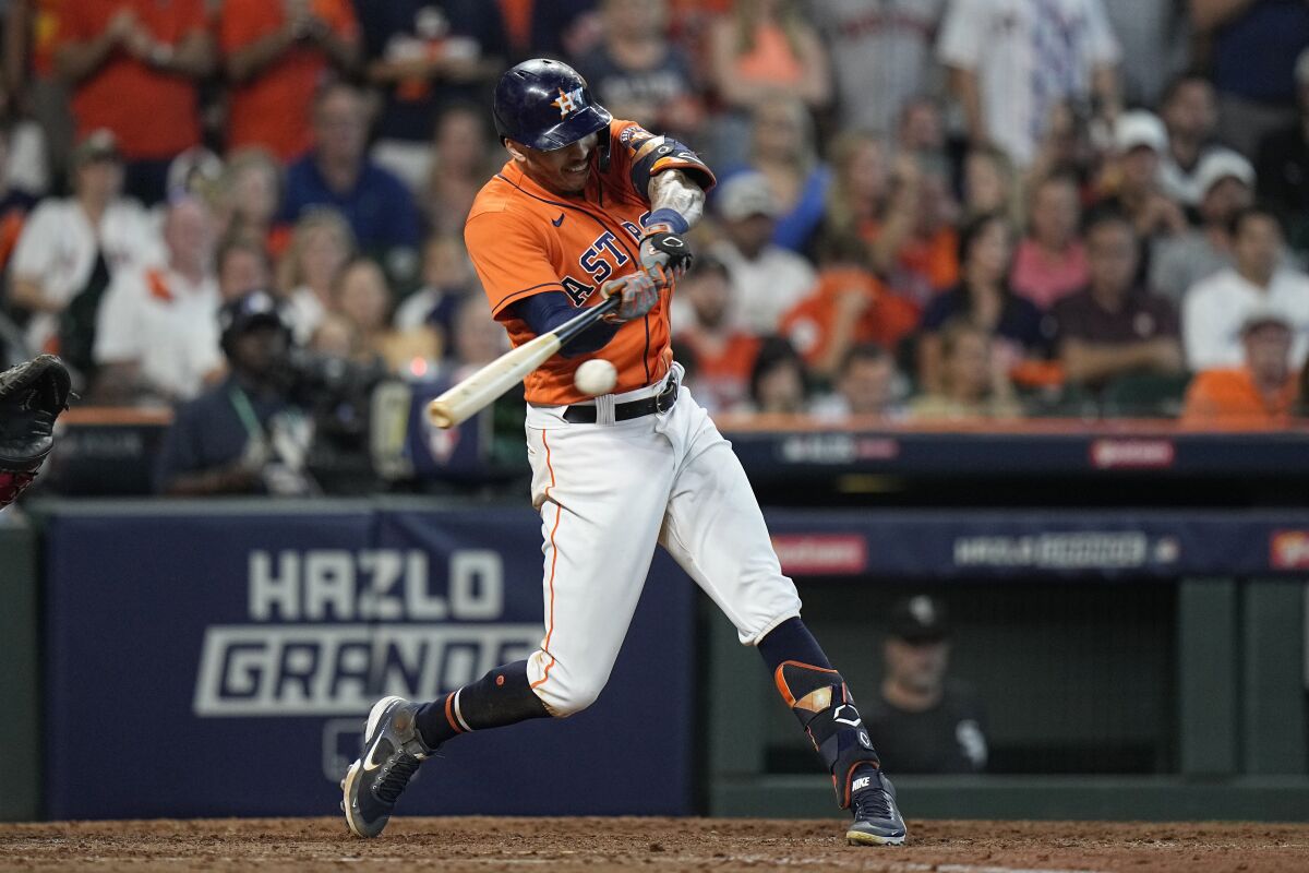 Houston Astros shortstop Carlos Correa hits a two-run double against the Chicago White Sox.