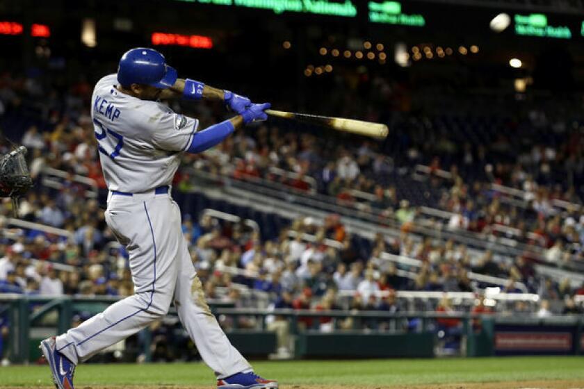 Matt Kemp hits a solo homer in the ninth inning of the Dodgers' victory over Washington on Wednesday.