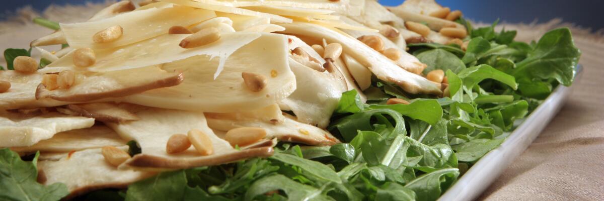 King oyster mushroom salad with arugula and shaved Parmigiano.