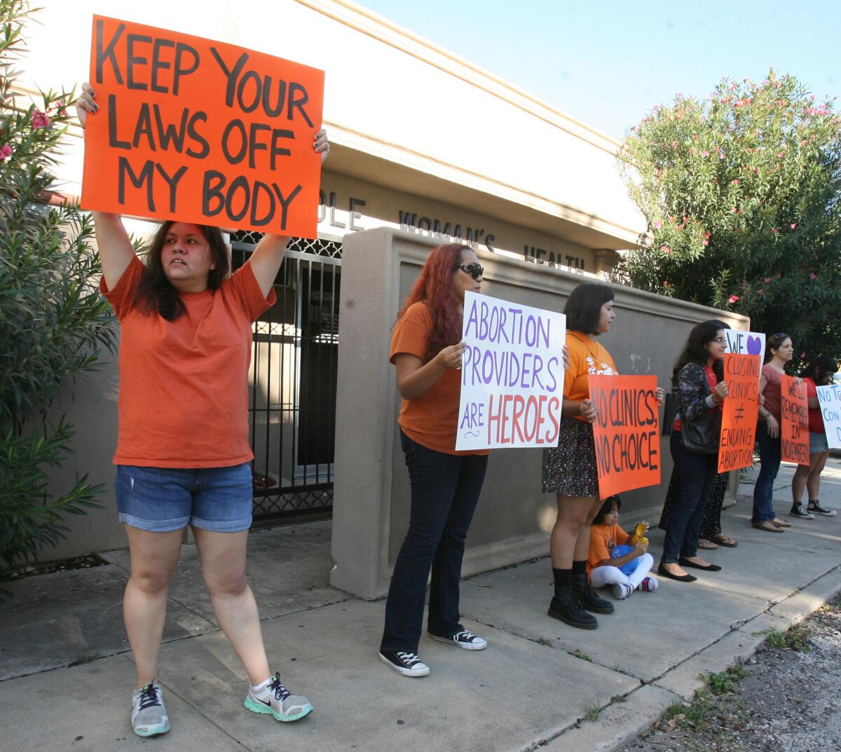 People protest in front of the Whole Women's Health clinic on Oct. 4, 2014 in McAllen, Texas.