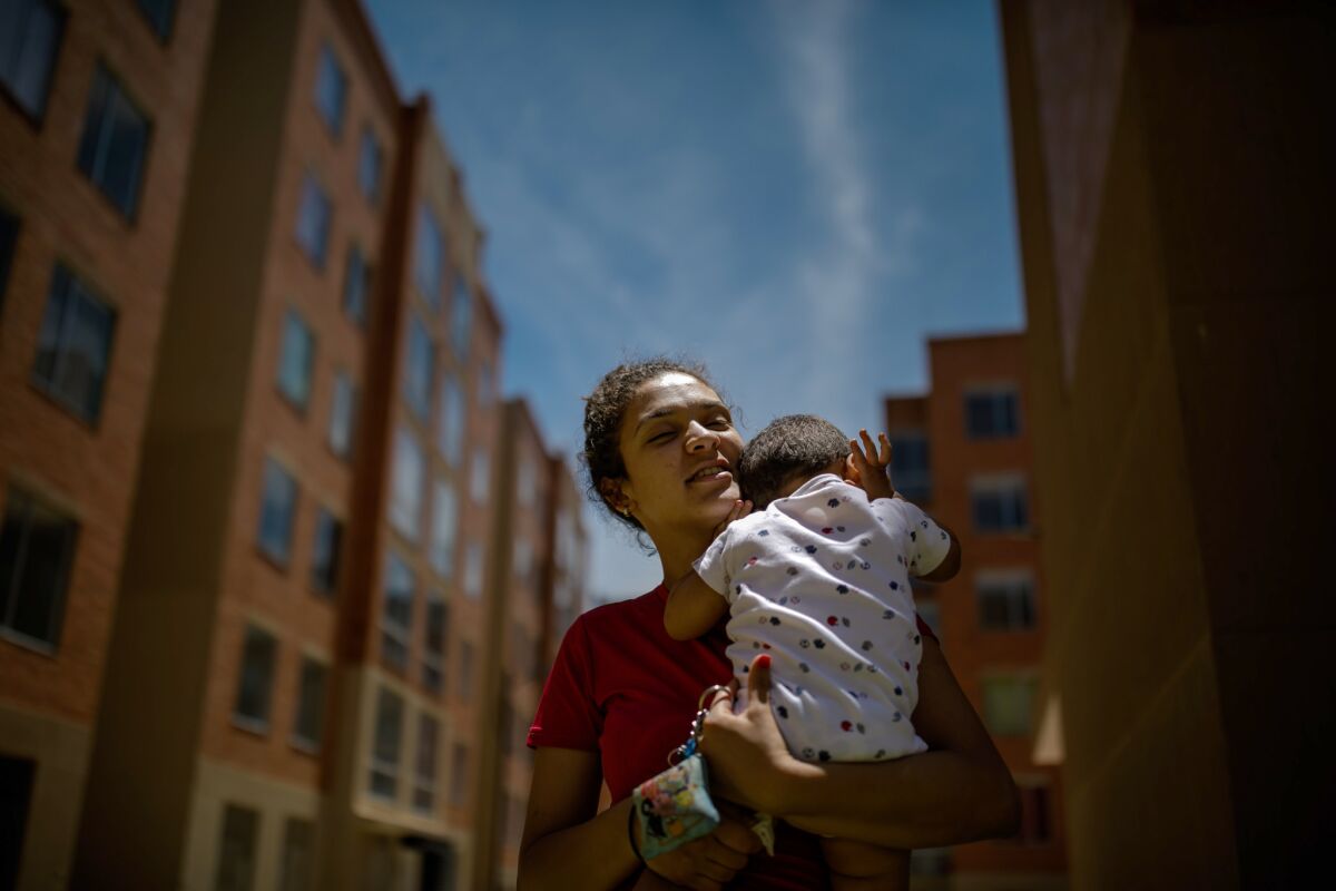 Kimberlyn Suarez Villegas, 24, with her son, Estheban, who will be 2 in November, in Bogota, Colombia.
