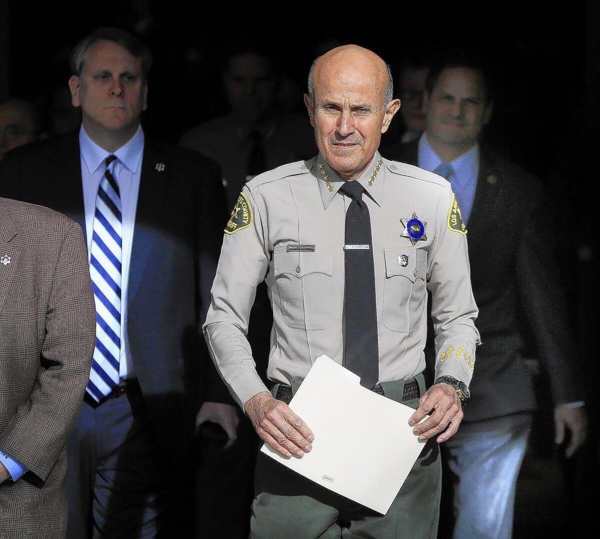 Then-Sheriff Lee Baca held high-level meetings after an inmate was found with an FBI cellphone in 2011, a defendant testified.