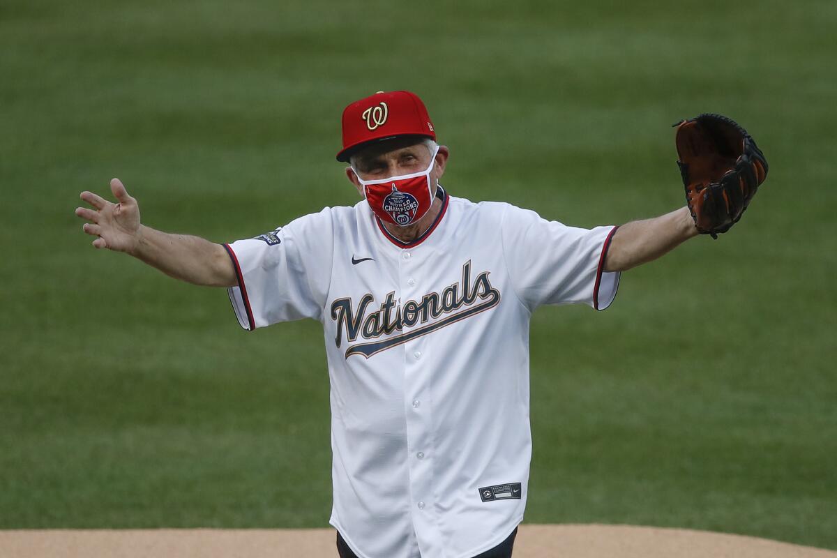 Dr. Anthony Fauci reacts after throwing out the ceremonial first pitch for the Washington Nationals on July 23.