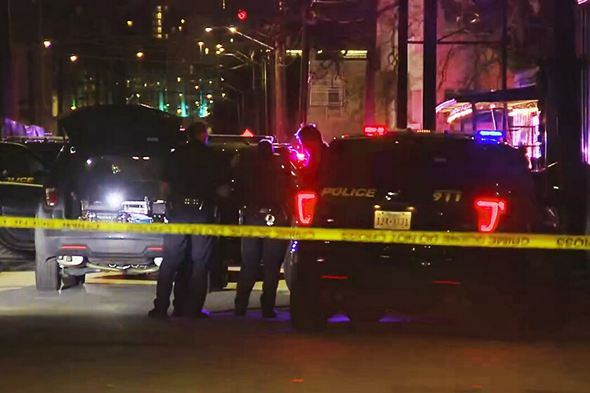 A photo taken from video shows San Antonio police officers at the scene of a fatal shooting Sunday night.