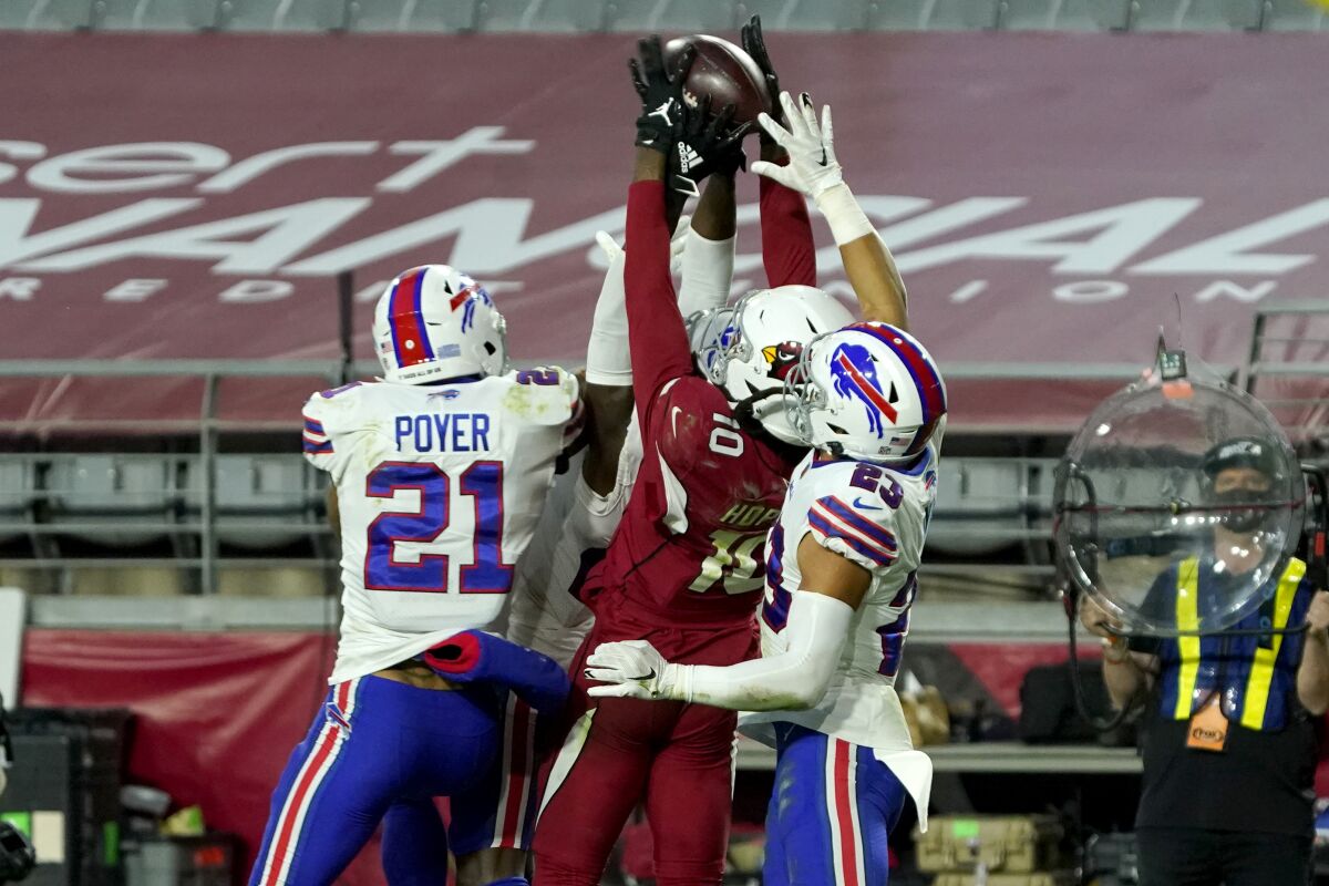 Cardinals wide receiver DeAndre Hopkins (10) beats three Bills players on a game-winning, Hail Mary touchdown catch.