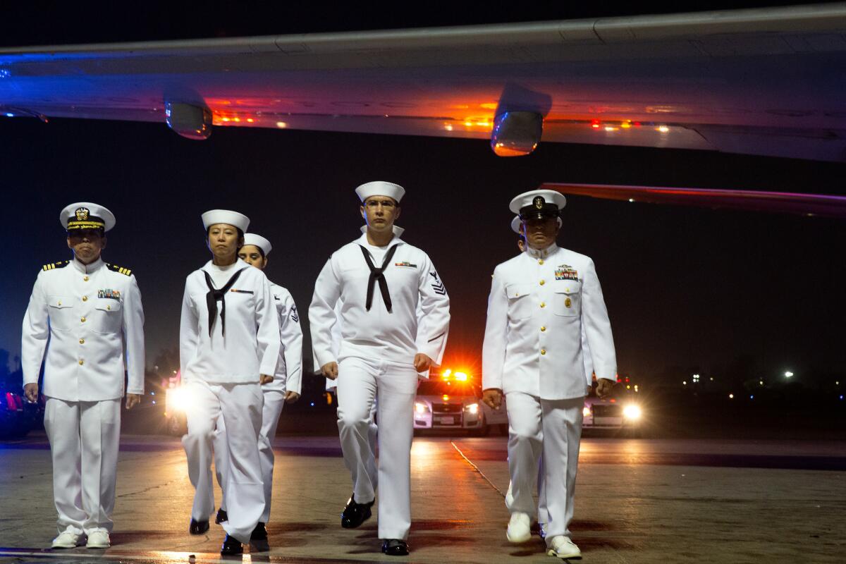 U.S. Navy sailors at Los Angeles International Airport. It took the U.S. government nearly 40 years to recover the wreckage of the E-1B Tracer aircraft that crashed, killing Guerra in 1967.