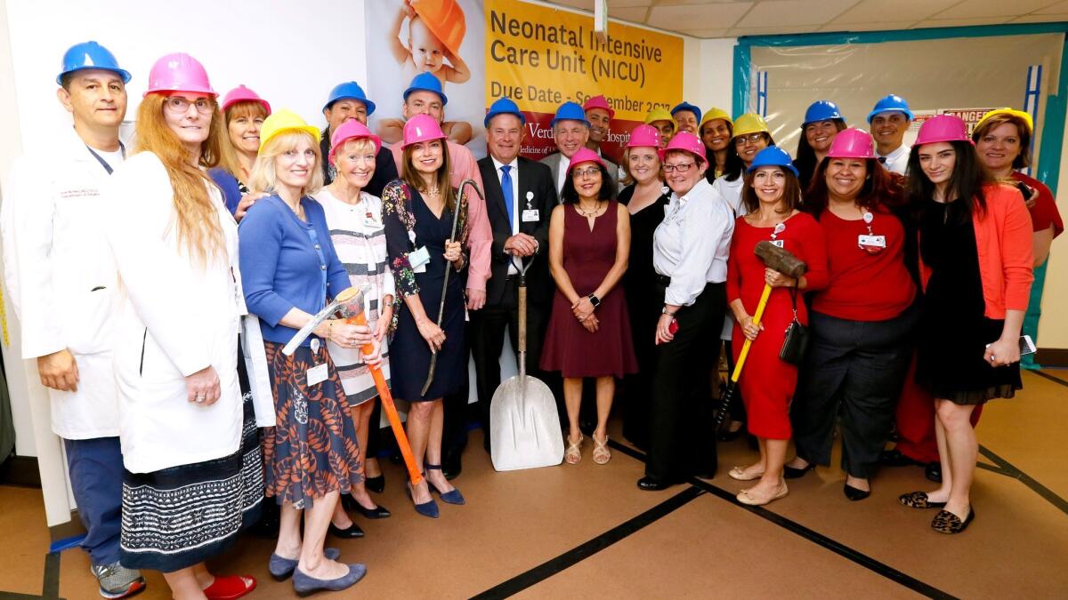 USC Verdugo Hills Hospital Chief Executive Officer Keith Hobbs center with shovel, stands with staff members during ceremony to kick off construction of a new Neonatal Intensive Care Unit.