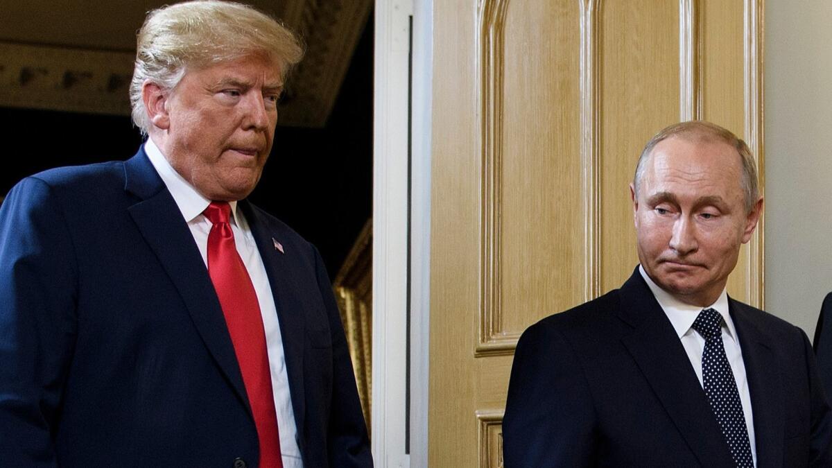President Trump and Russian President Vladimir Putin arrive for their summit meeting in Helsinki, Finland, on July 16.