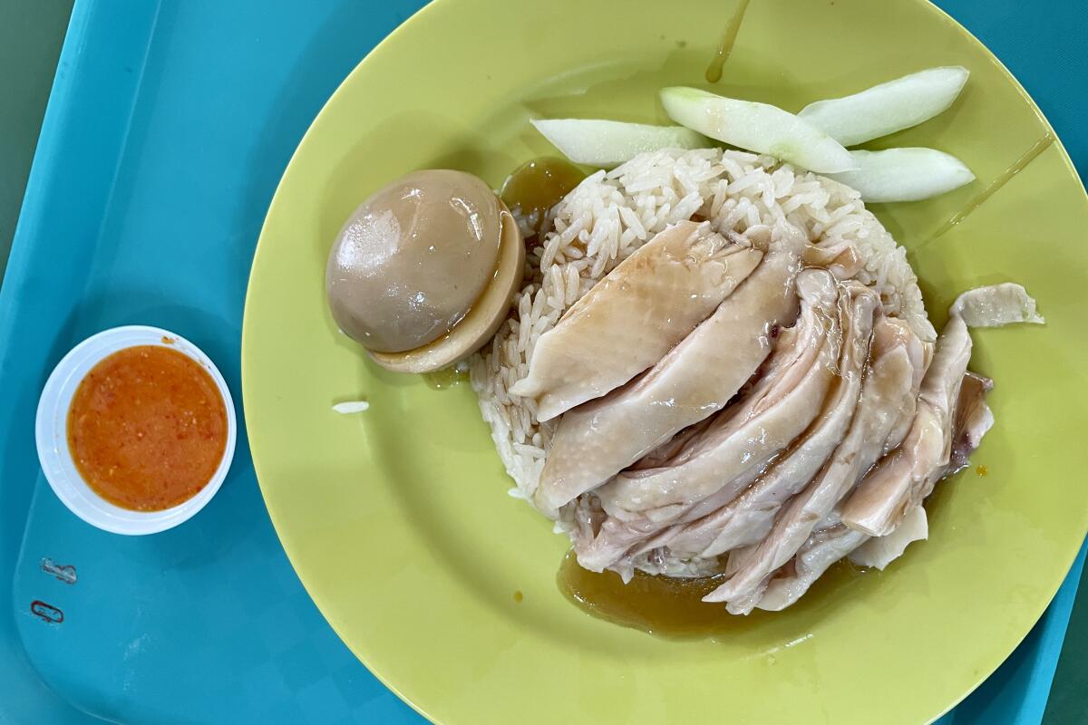 Chicken and rice from Tian Tian Hainanese Chicken Rice at Maxwell Food Centre hawker center in Singapore.