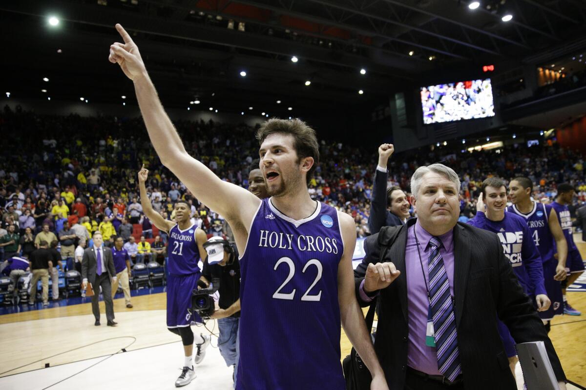 Holy Cross' Robert Champion (22) celebrates after the team's victory over Southern University, 59-55 in First Four game of the NCAA tournament on March 16.