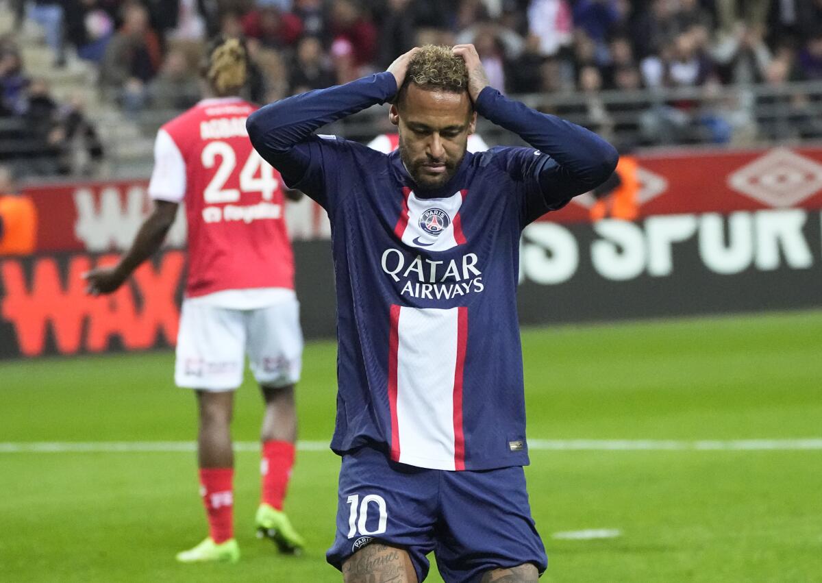 PSG's Neymar reacts during a French League One soccer match between Reims and Paris Saint-Germain, at the Stade Auguste-Delaune in Reims, eastern France, Saturday, Oct. 8, 2022. (AP Photo/Michel Euler)