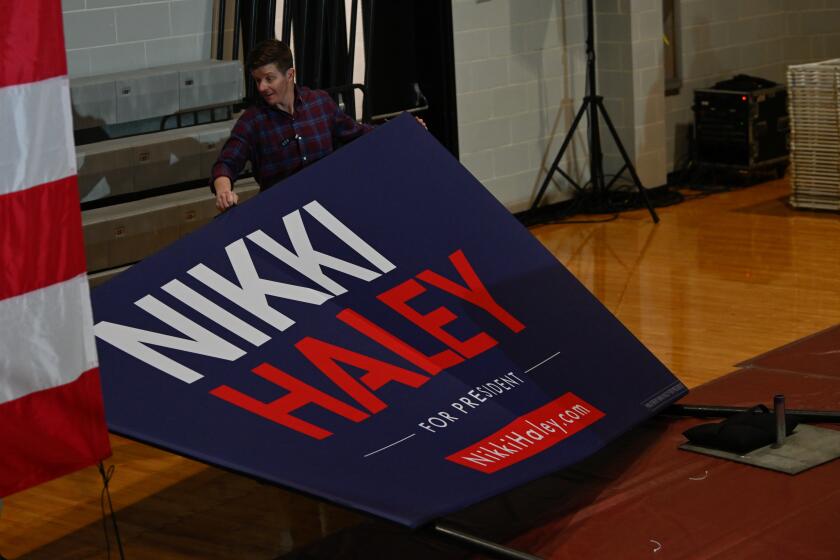 CONWAY, USA - JANUARY 28: A man lifts a banner written 'Nikki Haley for President' to prepare the campaign event venue hosted by Nikki Haley in Conway as part of her swing in the Palmetto State leading up to the State's primary, in Conway SC, United States on January 28, 2024. (Photo by Peter Zay/Anadolu via Getty Images)