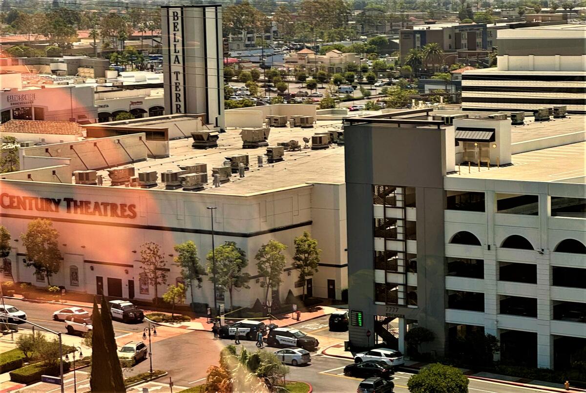 A photograph taken Wednesday in Huntington Beach shows police activity near a parking structure at the Bella Terra mall.