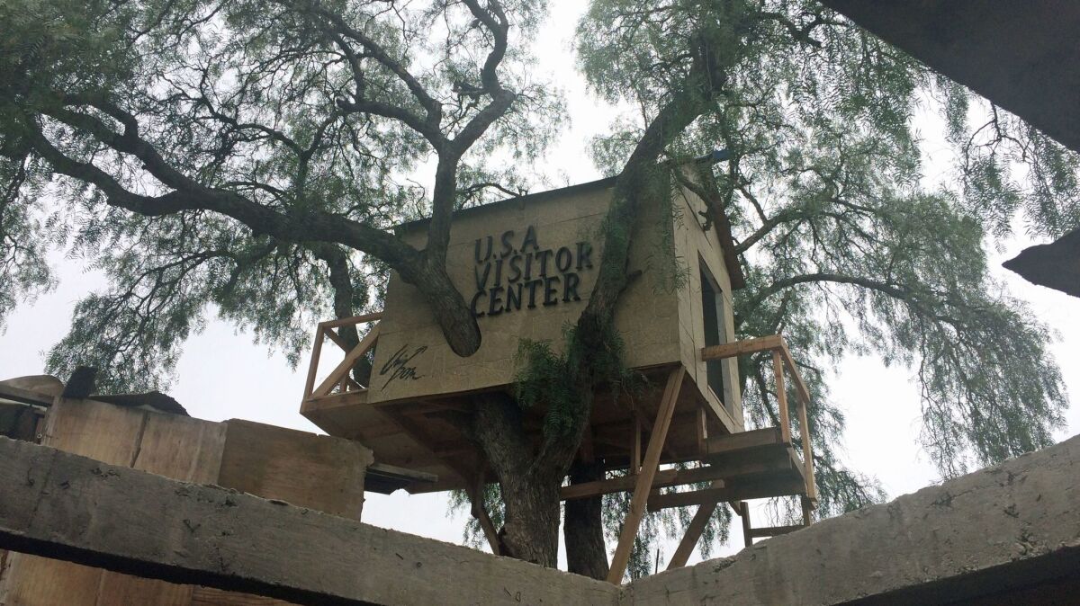 A view of the border treehouse created by Japanese art collective Chim Pom, which is titled "U.S.A. Visitor Center."