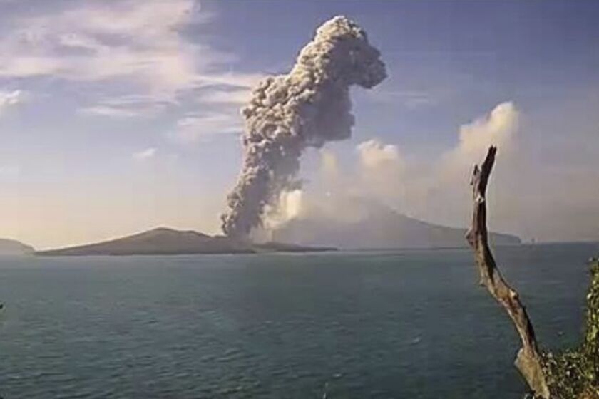 In this image made from video released by Indonesia's Center for Volcanology and Geological Disaster Mitigation Agency (PVMBG), Anak Krakatau volcano releases volcanic materials into the air as it erupts on Friday, June 9, 2023 on Sunda Strait, Indonesia. The volcano island erupted Saturday, spewing volcanic ash as high as three kilometers (nearly two miles) into the air, forcing authorities to halt tourism near one of the country's most active volcano. (PVMBG via AP)