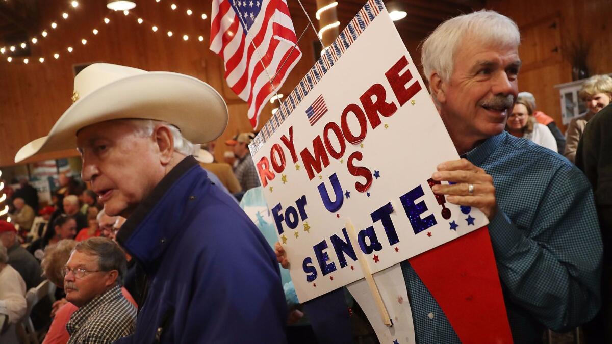 People attend a campaign rally for Republican Senate candidate Roy Moore on Dec. 5.