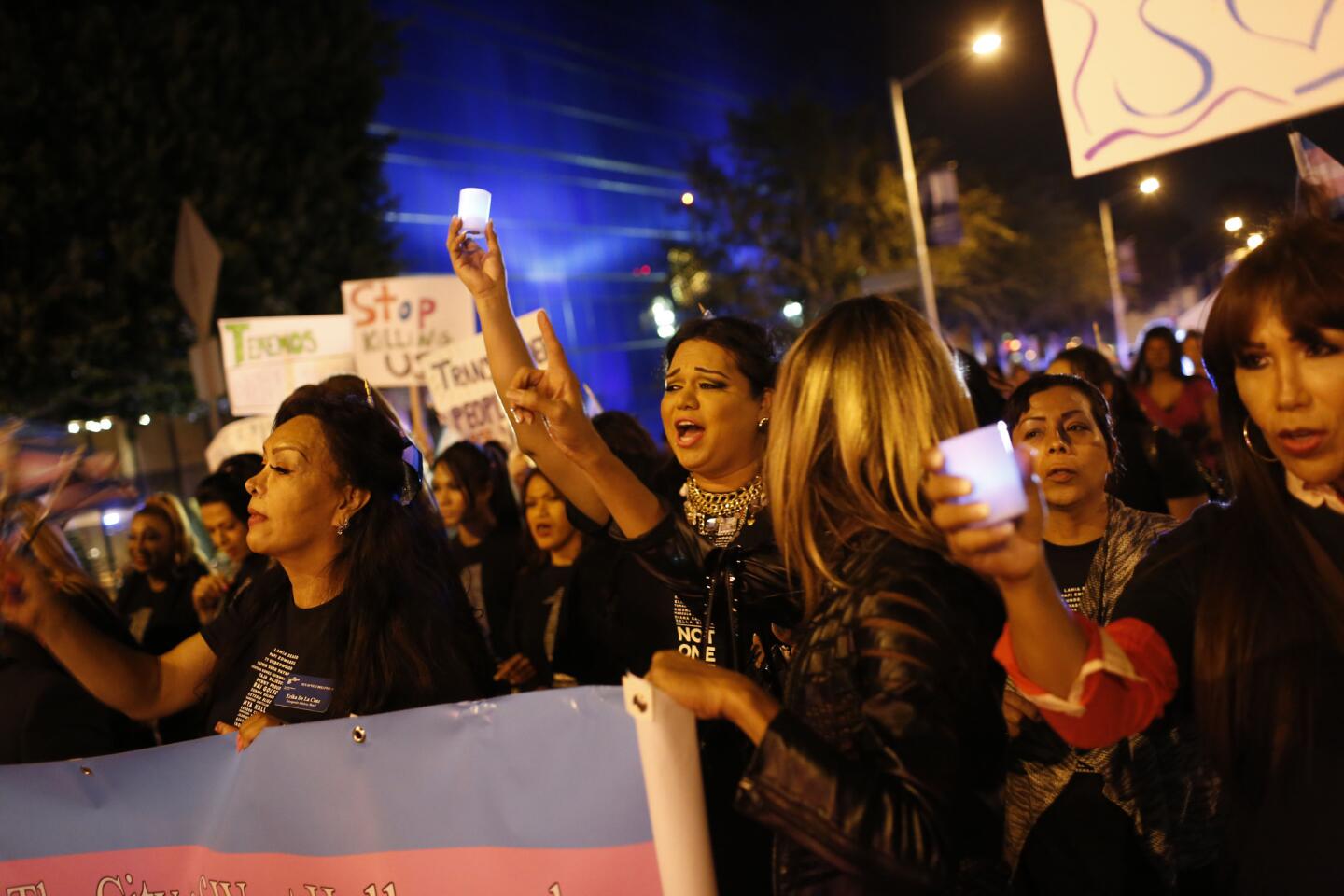 People gather outside the West Hollywood Public Library on Friday night to honor the Transgender Day of Remembrance, a somber annual event to acknowledge violence against trans people.