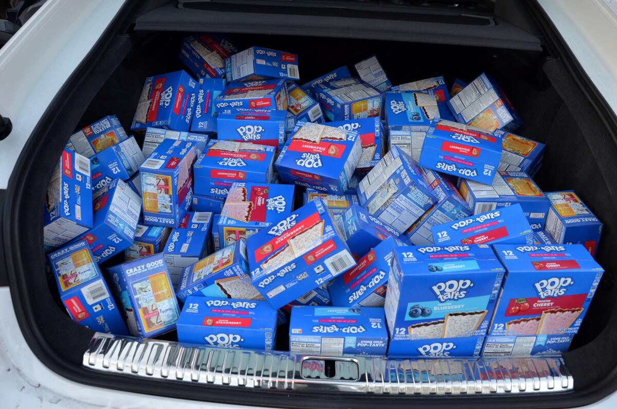 Boxes of Pop-Tarts fill a volunteer contributor's trunk during the Trunk & Pack food drive.