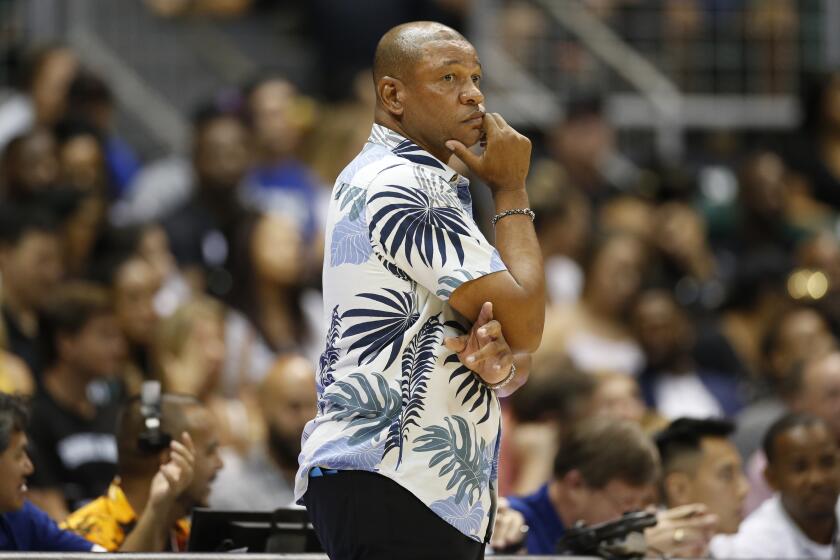 Los Angeles Clippers' head coach Doc Rivers watches the action during the second quarter of an NBA preseason basketball game against the Houston Rockets, Thursday, Oct 3, 2019, in Honolulu. (AP Photo/Marco Garcia)