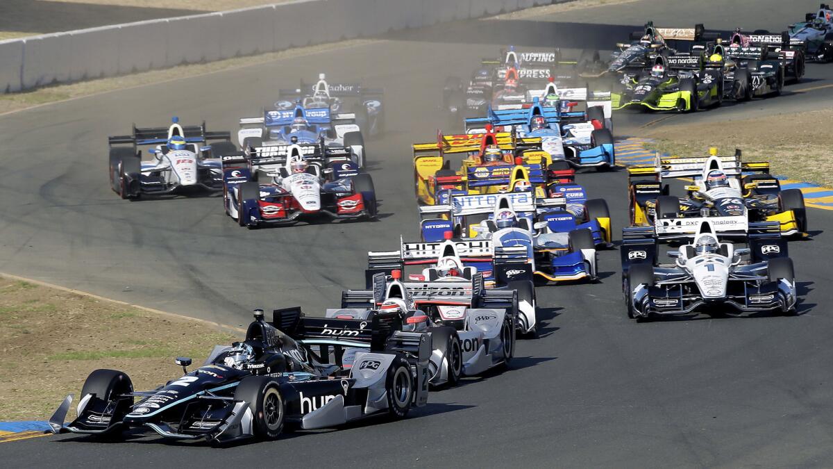 IndyCar driver Josef Newgarden leads cars through Turn 2 at the start of the race Sunday in Sonoma.
