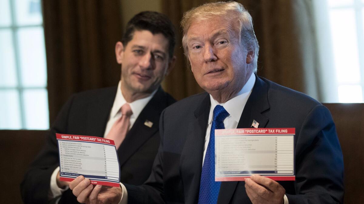 House Speaker Paul D. Ryan looks on as President Trump speaks about tax reform legislation Nov. 2 in the White House.